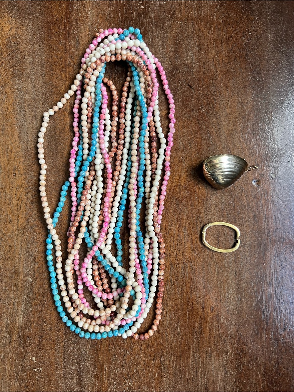 80s twist-a-bead necklace. 5 necklace strands and 2 gold tone closures